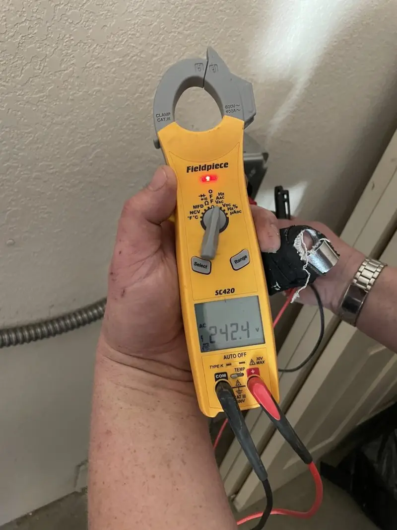Voltage testing with clamp meter during Outlet Installation in Dalton